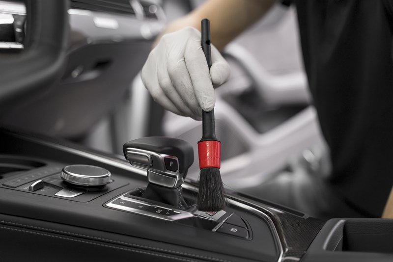 Close-up of exterior car detailing and surface care process